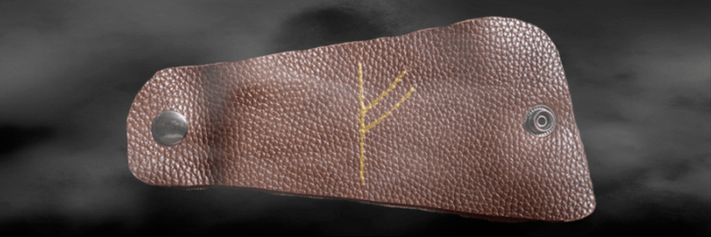 The rune fehu on the skin as a talisman of good luck